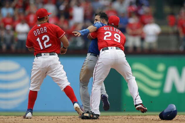 ARLINGTON, TX - MAY 15:  Adrian Beltre #29 of the Texas Rangers holds Jose Bautista #19 of the Toronto Blue Jays after being punched by Rougned Odor #12 in the eighth inning at Globe Life Park in Arlington on May 15, 2016 in Arlington, Texas.  (Photo by Ronald Martinez/Getty Images)