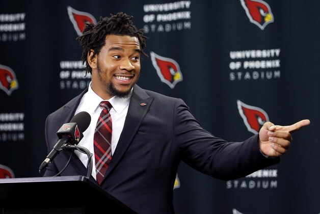 Arizona Cardinals' first-round draft pick Robert Nkemdiche points to head coach Bruce Arians after being introduced to the media, Friday, April 29, 2016, in Tempe, Ariz. Nkemdiche was the Cardinals' first round, 29th overall, pick in the NFL football draft. (AP Photo/Matt York)