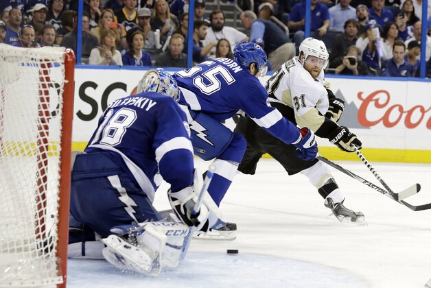 Tampa Bay Lightning goalie Andrei Vasilevskiy (88), of Russia, goes after a shot by Pittsburgh Penguins right wing Phil Kessel (81) as Lightning's Braydon Coburn (55) defends during the third period of Game 3 of the NHL hockey Stanley Cup Eastern Conference finals Wednesday, May 18, 2016, in Tampa, Fla. (AP Photo/Chris O'Meara)