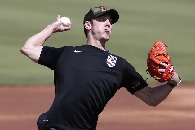 FILE - This May 6, 2016 file photo shows pitcher Tim Lincecum throwing for MLB baseball scouts at Scottsdale Stadium in Scottsdale, Ariz. The Los Angeles Angels are closing in on a deal to sign the two-time Cy Young Award winner, a free agent trying to come back from hip surgery, according to a person with knowledge of the negotiations, Monday, May 16, 2016. (AP Photo/Matt York, file)