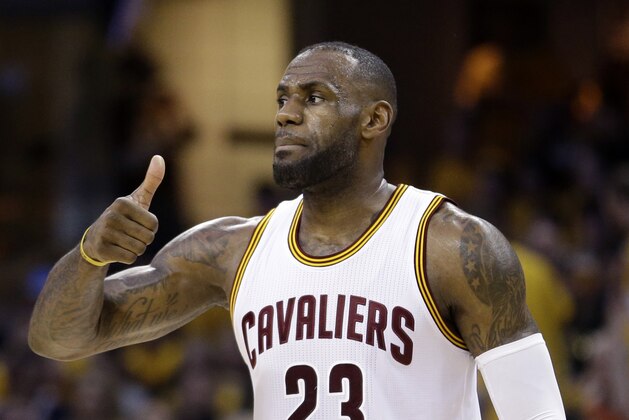 Cleveland Cavaliers' LeBron James (23) gestures during the first half against the Toronto Raptors in Game 2 of the NBA basketball Eastern Conference finals Thursday, May 19, 2016, in Cleveland. (AP Photo/Tony Dejak)