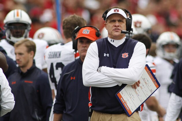 Auburn's Gus Malzahn looks to the scoreboard  during the first half of an NCAA college football game against Arkansas, Saturday, Oct. 24, 2015, in Fayetteville, Ark. Arkansas won 54-46 in four overtimes. (AP Photo/Samantha Baker)