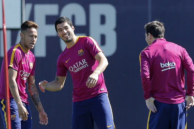 FC Barcelona's Neymar, left, Luis Suarez, centre, and Lionel Messi exercise during a training session at the Sports Center FC Barcelona Joan Gamper in Sant Joan Despi, Spain, Saturday, April 16, 2016. (AP Photo/Manu Fernandez)