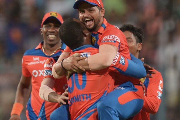 Gujarat Lions captain Suresh Raina(C)celebrates with teammates after the dismissal of Kolkata Knight Riders batsman Suryakumar Yadav during the 2016 Indian Premier League (IPL) Twenty20 cricket match between Kolkata Knight Riders and Gujarat Lions at The Eden Gardens Cricket Stadium in Kolkata on May 8, 2016./ GETTYOUT / ----IMAGE RESTRICTED TO EDITORIAL USE - STRICTLY NO COMMERCIAL USE----- / GETTYOUT / AFP / Dibyangshu SARKAR        (Photo credit should read DIBYANGSHU SARKAR/AFP/Getty Images)