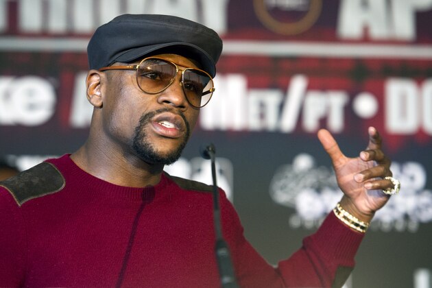 Five-division world champion Floyd Mayweather talks in Washington, Feb. 29, 2016, about the upcoming world title fight between four-division world champion Adrien