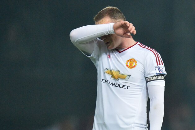 Manchester United's English striker Wayne Rooney reacts after losing the English Premier League football match between West Ham United and Manchester United at The Boleyn Ground in Upton Park, in east London on May 10, 2016. / AFP / GLYN KIRK / RESTRICTED TO EDITORIAL USE. No use with unauthorized audio, video, data, fixture lists, club/league logos or 'live' services. Online in-match use limited to 75 images, no video emulation. No use in betting, games or single club/league/player publications.  /         (Photo credit should read GLYN KIRK/AFP/Getty Images)