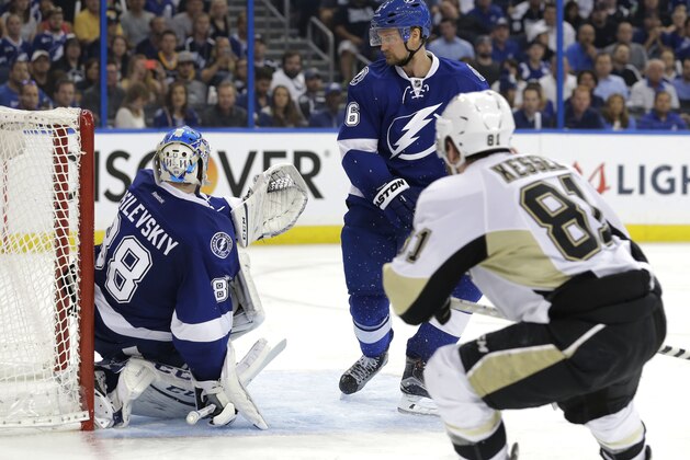 Tampa Bay Lightning goalie Andrei Vasilevskiy (88), of Russia, looks back as Pittsburgh Penguins right wing Phil Kessel (81) scores a goal during the third period of Game 3 of the NHL hockey Stanley Cup Eastern Conference finals Wednesday, May 18, 2016, in Tampa, Fla. Lightning defenseman Anton Stralman is at center. (AP Photo/Chris O'Meara)