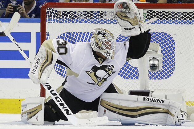 Pittsburgh Penguins goalie Matt Murray (30) makes a glove save on a shot by the Tampa Bay Lightning during the third period of Game 3 of the NHL hockey Stanley Cup Eastern Conference Finals Wednesday, May 18, 2016, in Tampa, Fla. The Penguins won the game 4-2. (AP Photo/Chris O'Meara)