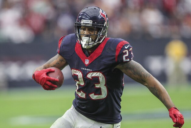 Dec 21, 2014; Houston, TX, USA; Houston Texans running back Arian Foster (23) rushes during the third quarter against the Baltimore Ravens at NRG Stadium. The Texans defeated the Ravens 25-13. Mandatory Credit: Troy Taormina-USA TODAY Sports