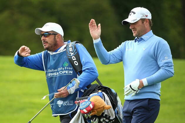 STRAFFAN, IRELAND - MAY 20:  Marc Warren of Scotland lines up with his caddie Ken Herring on the 18th hole during the second round of the Dubai Duty Free Irish Open Hosted by the Rory Foundation at The K Club on May 20, 2016 in Straffan, Ireland.  (Photo by Andrew Redington/Getty Images)