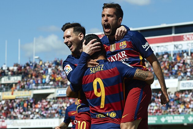 GRANADA, SPAIN - MAY 14:  Luis Suarez of FC Barcelona celebrates scoring his team's first goal with his teamates Lionel Messi and Jordi Alba during the La Liga match between Granada CF and FC Barcelona at Estadio Nuevo Los Carmenes on May 14, 2016 in Granada, Spain.  (Photo by Manuel Queimadelos Alonso/Getty Images)