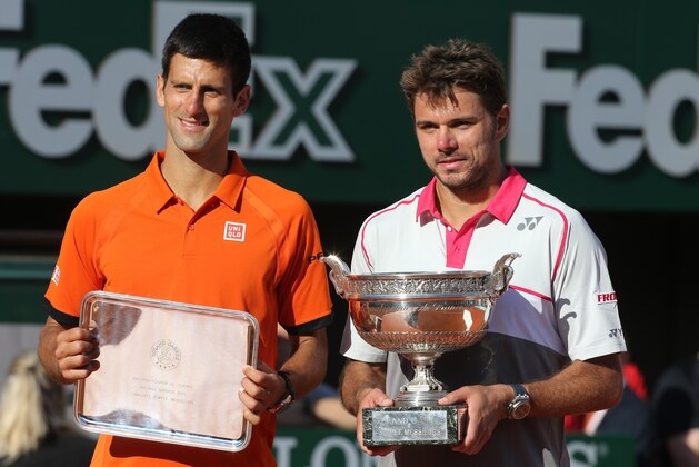 PARIS, FRANCE - JUNE 7: Stanislas Wawrinka of Switzerland (right) poses with the Coupe de Mousquetaires and runner up Novak Djokovic of Serbia  after the men's final on day 15 of the French Open 2015 at Roland Garros stadium on June 1, 2015 in Paris, France. (Photo by Jean Catuffe/Getty Images)