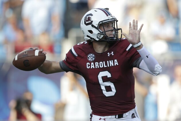 South Carolina's Connor Mitch looks to pass against North Carolina in the first half of an NCAA college football game in Charlotte, N.C., Thursday, Sept. 3, 2015. (AP Photo/Chuck Burton)