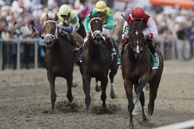 Go Maggie Go with Luis Saez aboard, right, wins the Black-Eyed Susan horse race at Pimlico Race Course as Kinsley Kisses with John Velazquez center and rider Joe Rocco rides Mom's On Strike, come in Friday, May 20, 2016, in Baltimore. The 141st Preakness Stakes horse race runs Saturday, May 21. (AP Photo/Matt Slocum)