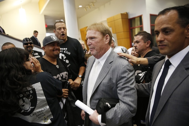 Oakland Raiders Owner Mark Davis, center, meets with Raiders fans after speaking at a meeting of the Southern Nevada Tourism Infrastructure Committee, Thursday, April 28, 2016, in Las Vegas. (AP Photo/John Locher)