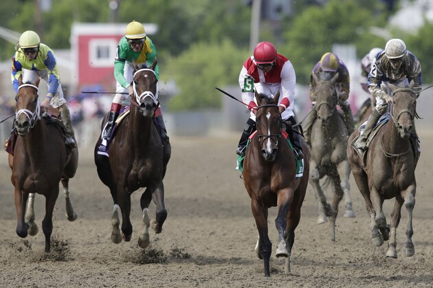 Go Maggie Go with Luis Saez aboard, third from left, wins the Black-Eyed Susan horse race at Pimlico Race Course as Kinsley Kisses with John Velazquez center and rider Brian Hernandez Jr. rides Ma Can Do It, come in Friday, May 20, 2016, in Baltimore. The 141st Preakness Stakes horse race runs Saturday, May 21. (AP Photo/Patrick Semansky)