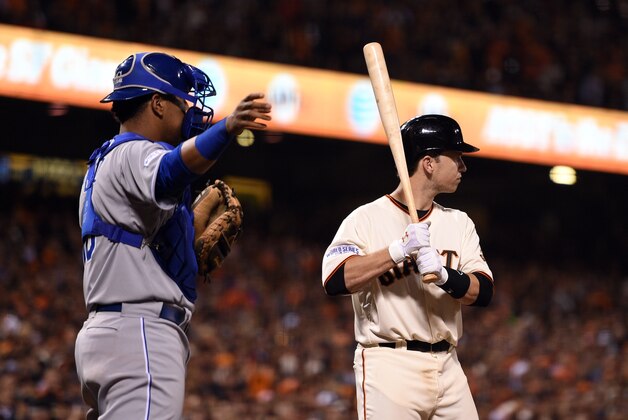 Oct 25, 2014; San Francisco, CA, USA; Kansas City Royals catcher Salvador Perez (left) calls for an intentional walk on San Francisco Giants catcher Buster Posey (right) in the sixth inning during game four of the 2014 World Series at AT&amp;T Park. Mandatory Credit: Kyle Terada-USA TODAY Sports