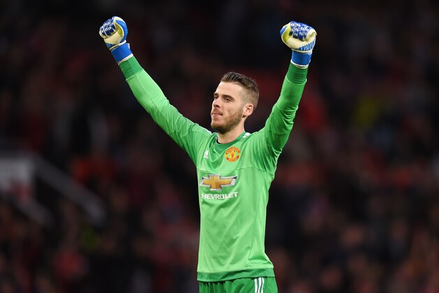 MANCHESTER, ENGLAND - MAY 17:  David De Gea of Manchester United celebrates as Wayne Rooney of Manchester United scores their first goal during the Barclays Premier League match between Manchester United and AFC Bournemouth at Old Trafford on May 17, 2016 in Manchester, England.  (Photo by Michael Regan/Getty Images)