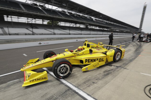 Helio Castroneves, of Brazil, pulls out of the pits during a practice session for the Indianapolis 500 auto race at Indianapolis Motor Speedway in Indianapolis, Monday, May 16, 2016. (AP Photo/Darron Cummings)