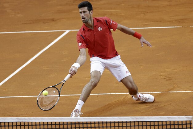 Novak Djokovic returns a ball to Andy Murray, during their final match at the Italian Open tennis tournament, in Rome, Sunday, May 15, 2016. (AP Photo/Alessandra Tarantino)