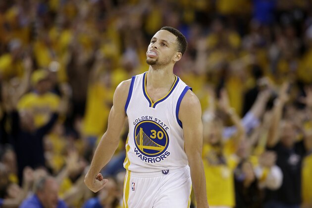 Golden State Warriors guard Stephen Curry (30) reacts after scoring against the Oklahoma City Thunder during the first half of Game 1 of the NBA basketball Western Conference finals in Oakland, Calif., Monday, May 16, 2016. (AP Photo/Marcio Jose Sanchez)