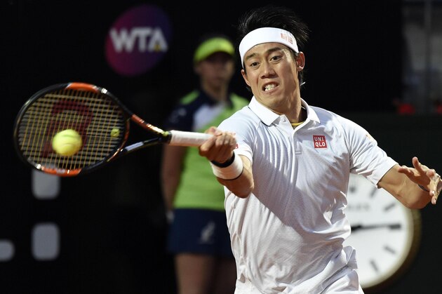 Kei Nishikori returns the ball to Novak Djokovic during their semifinal match at the Italian Open tennis tournament, in Rome, Saturday, May 14, 2016. (Claudio Onorati/ANSA via AP)