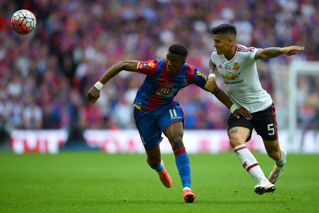 LONDON, ENGLAND - MAY 21:  Wilfried Zaha of Crystal Palace battles with Marcos Rojo of Manchester United during The Emirates FA Cup Final match between Manchester United and Crystal Palace at Wembley Stadium on May 21, 2016 in London, England.  (Photo by Shaun Botterill/Getty Images)