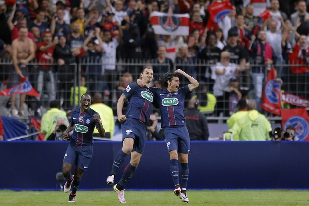 PSG's Zlatan Ibrahimovic, center, reacts, with PSG's Edinson Cavani, right, after scoring his side second goal during the French Cup final soccer match between Marseille and PSG at the Stade de France Stadium, in Saint Denis, North of Paris, Saturday, May 21, 2016. (AP Photo/Francois Mori)