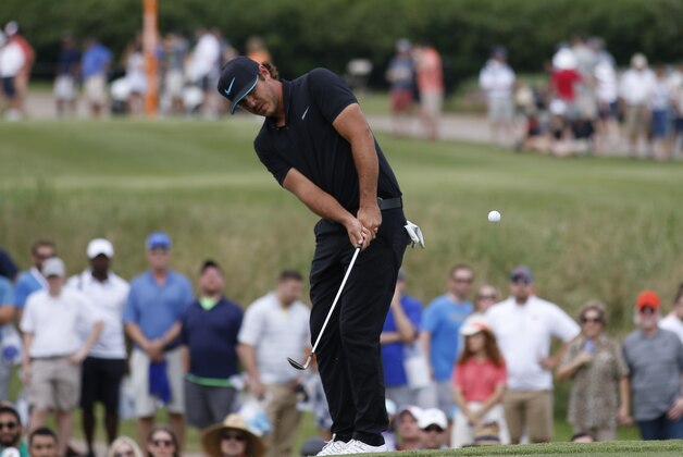 May 21, 2016; Irving, TX, USA;  Brooks Koepka chips on the first hole during the third round of the 2016 AT&T Byron Nelson golf tournament at TPC Four Seasons Resort - Las Colinas. Mandatory Credit: Ray Carlin-USA TODAY Sports