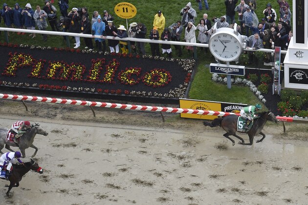 Exaggerator with Kent Desormeaux aboard wins the 141st Preakness Stakes horse race as Cherry Wine with Corey Lanerie atop and Nyquist with Mario Gutierrez aboard come in at Pimlico Race Course, Saturday, May 21, 2016, in Baltimore.  (AP Photo/Nick Wass)