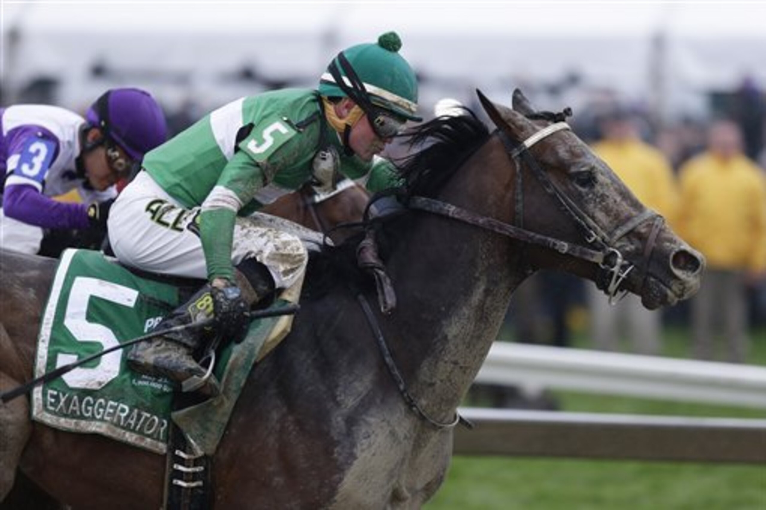 Exaggerator (5), with Kent Desormeaux aboard, moves past Nyquist (3), with Mario Gutierrez riding, during the 141st Preakness Stakes horse race at Pimlico Race Course, Saturday, May 21, 2016, in Baltimore. Exaggerator won the race. (AP Photo/Garry Jones)