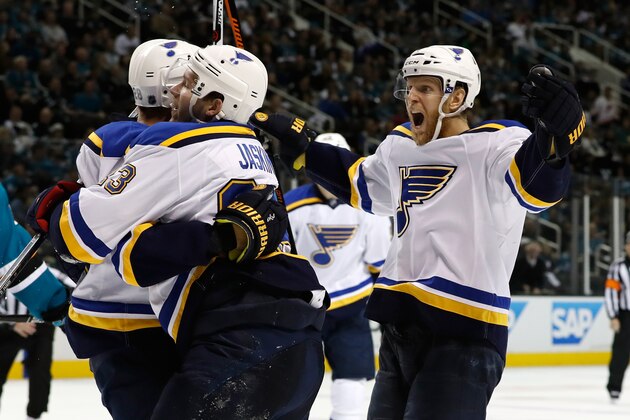 SAN JOSE, CA - MAY 21:  Kyle Brodziak #28 of the St. Louis Blues celebrates  with Carl Gunnarsson #4 and Dmitrij Jaskin #23 after his second goal in game four of the Western Conference Finals against the San Jose Sharks during the 2016 NHL Stanley Cup Playoffs at SAP Center on May 21, 2016 in San Jose, California.  (Photo by Christian Petersen/Getty Images)