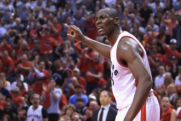 TORONTO, ON - MAY 21:  Bismack Biyombo #8 of the Toronto Raptors reacts during the first half against the Cleveland Cavaliers in game three of the Eastern Conference Finals during the 2016 NBA Playoffs at Air Canada Centre on May 21, 2016 in Toronto, Canada.  (Photo by Vaughn Ridley/Getty Images)