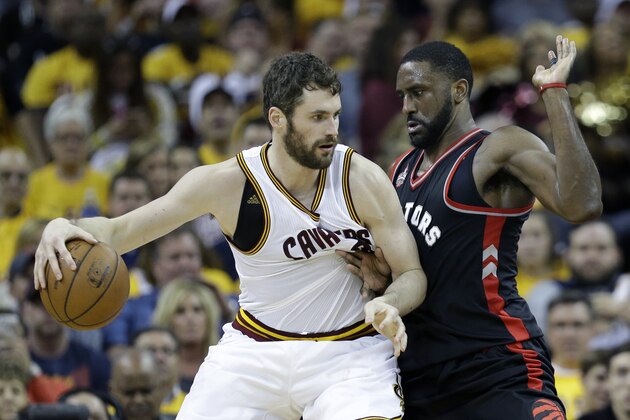 Cleveland Cavaliers' Kevin Love (0) backs down Toronto Raptors' Patrick Patterson (54) during the first half of Game 1 of the NBA basketball Eastern Conference finals, Tuesday, May 17, 2016, in Cleveland. (AP Photo/Tony Dejak)