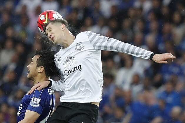 Leicester City's Japanese striker Shinji Okazaki (L) jumps for a header with Everton's English defender John Stones during the English Premier League football match between Leicester City and Everton at King Power Stadium in Leicester, central England on May 7, 2016. / AFP / ADRIAN DENNIS / RESTRICTED TO EDITORIAL USE. No use with unauthorized audio, video, data, fixture lists, club/league logos or 'live' services. Online in-match use limited to 75 images, no video emulation. No use in betting, games or single club/league/player publications.  /         (Photo credit should read ADRIAN DENNIS/AFP/Getty Images)
