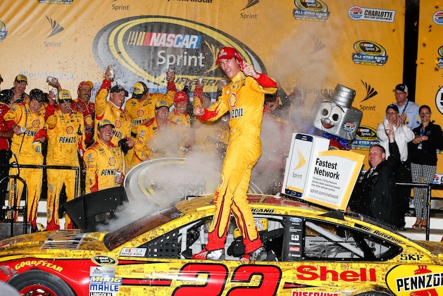 May 21, 2016; Concord, NC, USA; Sprint Cup Series driver Joey Logano (22) celebrates his win in victory lane in the Sprint All-Star Race at Charlotte Motor Speedway. Mandatory Credit: Jim Dedmon-USA TODAY Sports