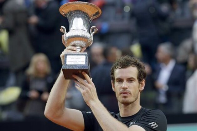 FILE - This May 15, 2016 file photo shows Andy Murray raising the trophy after defeating Novak Djokovic in the final match of the Italian Open tennis tournament in Rome. The French Open begins on Sunday, May 22. (AP Photo/Alessandra Tarantino, file)