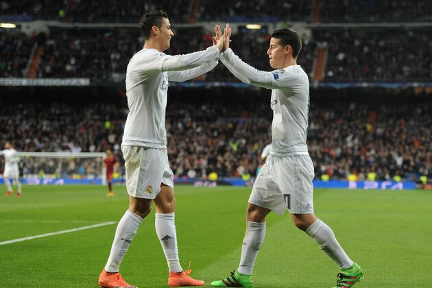 MADRID, SPAIN - MARCH 08:  James Rodriguez (R) of Real Madrid celebrates scoring his team's second goal with Cristiano Ronaldo during the UEFA Champions League Round of 16 Second Leg match between Real Madrid and Roma at Estadio Santiago Bernabeu on March 8, 2016 in Madrid, Spain.  (Photo by Denis Doyle/Getty Images)