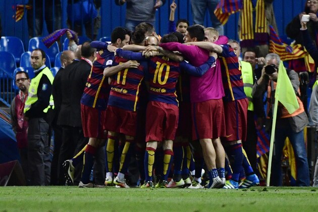 Barcelona players celebrate during the Spanish 'Copa del Rey' (King's Cup) final match FC Barcelona vs Sevilla FC at the Vicente Calderon stadium in Madrid on May 22, 2016. / AFP / PIERRE-PHILIPPE MARCOU        (Photo credit should read PIERRE-PHILIPPE MARCOU/AFP/Getty Images)