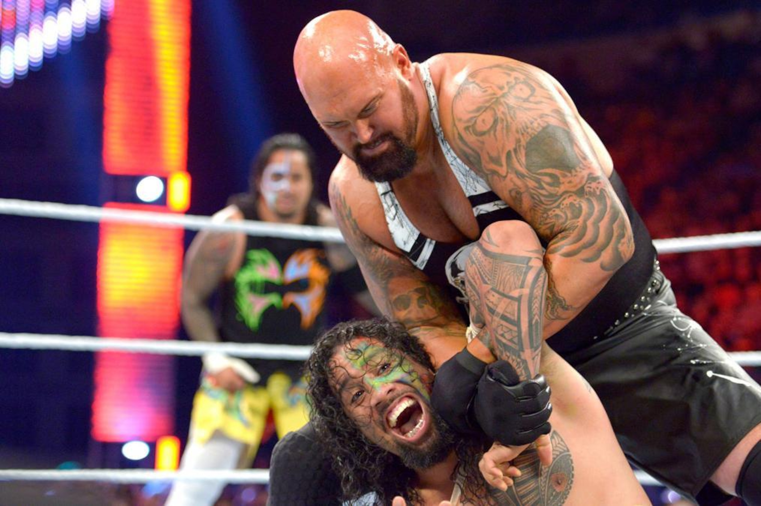 WWE wrestler Jimmy Usos, right, puts down Kofi Kingston during WWE Live India Tour, in New Delhi, Friday, Jan. 15, 2016. WWE returned to Indian after a gap of 13 years to entertain their fans. (AP Photo/Manish Swarup)