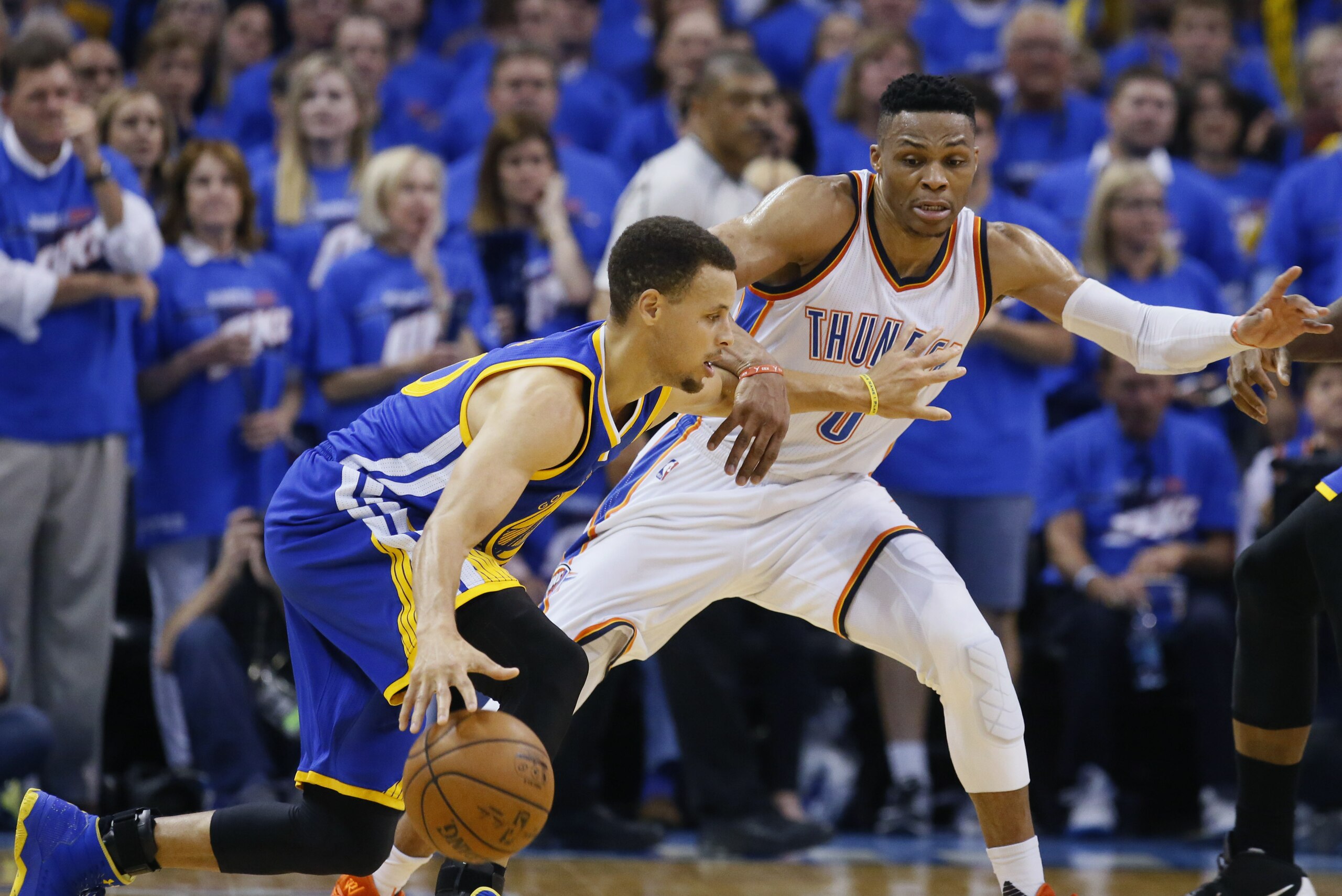 Golden State Warriors guard Stephen Curry (30) tries to drive around Oklahoma City Thunder guard Russell Westbrook (0) during the second half in Game 3 of the NBA basketball Western Conference finals  in Oklahoma City, Sunday, May 22, 2016. (AP Photo/Sue Ogrocki)