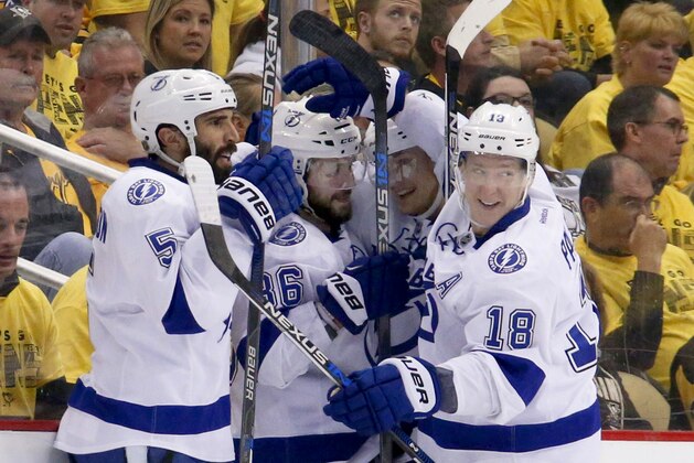 Tampa Bay Lightning's Nikita Kucherov (86), center left, is greeted by teammates after scoring against the Pittsburgh Penguins during the second period of Game 5 of the NHL hockey Stanley Cup Eastern Conference finals, Sunday, May 22, 2016, in Pittsburgh. (AP Photo/Gene J. Puskar)