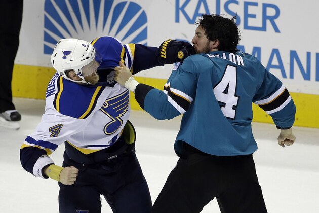 St. Louis Blues' Carl Gunnarsson, left, fights with San Jose Sharks' Brenden Dillon (4) during the third period in Game 4 of the NHL hockey Stanley Cup Western Conference finals Saturday, May 21, 2016, in San Jose, Calif. St. Louis won 6-3. (AP Photo/Marcio Jose Sanchez)