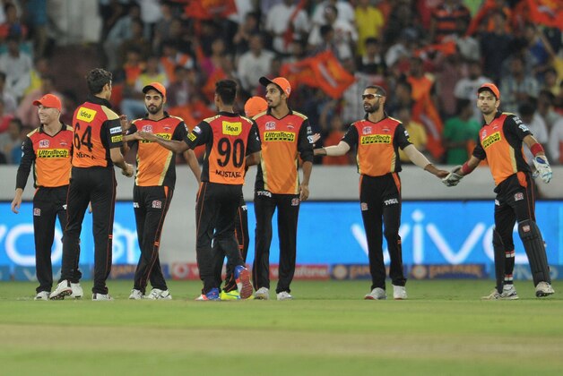 Sunrisers Hyderabad team celebrates the wicket of Royal Challengers Bangalore Sachin Baby during the 2016 Indian Premier League (IPL) Twenty20 cricket match between Sunrisers Hyderabad and Royal Challengers Bangalore at The Rajiv Gandhi International Stadium in Hyderabad  on April 30, 2016.  / AFP / NOAH SEELAM        (Photo credit should read NOAH SEELAM/AFP/Getty Images)