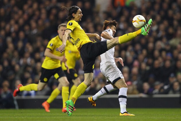 LONDON, ENGLAND - MARCH 17:  Neven Subotic of Borussia Dortmund clears the ball from Son Heung-min of Tottenham Hotspur during the UEFA Europa League round of 16, second leg match between Tottenham Hotspur and Borussia Dortmund at White Hart Lane on March 17, 2016 in London, England.  (Photo by Paul Gilham/Getty Images)