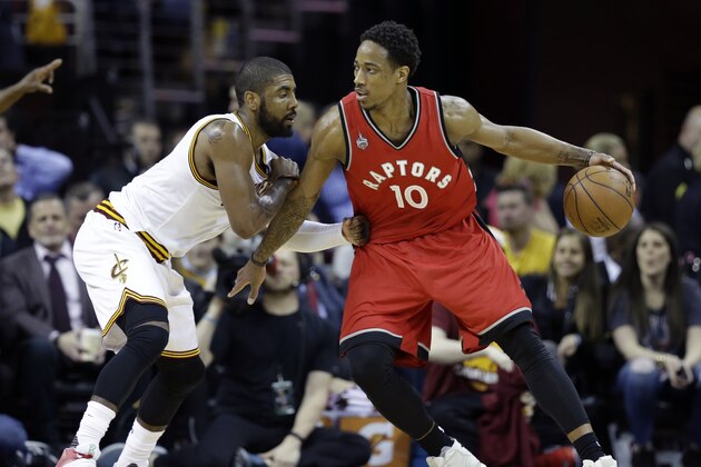 Toronto Raptors' DeMar DeRozan (10) looks to drive on Cleveland Cavaliers' Kyrie Irving (2) during the second half of Game 2 of the NBA basketball Eastern Conference finals Thursday, May 19, 2016, in Cleveland. (AP Photo/Tony Dejak)