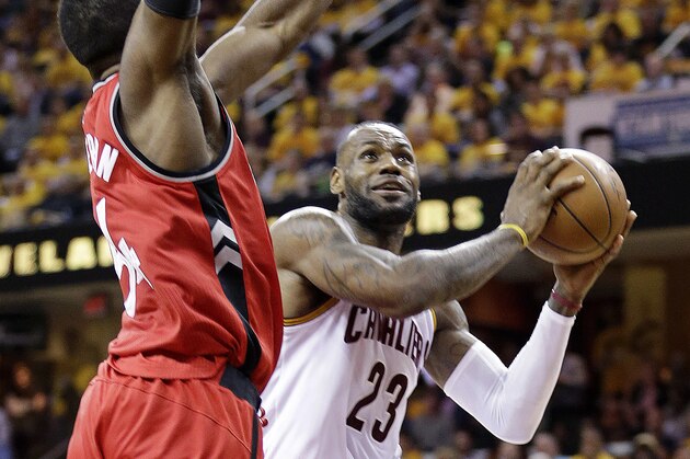Cleveland Cavaliers' LeBron James (23) goes up for a shot against Toronto Raptors' Patrick Patterson (54) during the second half of Game 2 of the NBA basketball Eastern Conference finals Thursday, May 19, 2016, in Cleveland. (AP Photo/Tony Dejak)