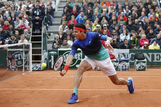 Canada's Milos Raonic returns in his first round match of the French Open tennis tournament against Serbia's Janko Tipsarevic at Roland Garros stadium in Paris, France, Monday, May 23, 2016. (AP Photo/Alastair Grant)
