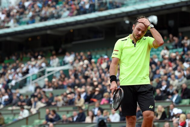 Switzerland's Stanislas Wawrinka reacts after loosing a point against Czech Republic's Lukas Rosol during the men's first round match at the Roland Garros 2016 French Tennis Open in Paris on May 23, 2016. / AFP / MIGUEL MEDINA        (Photo credit should read MIGUEL MEDINA/AFP/Getty Images)