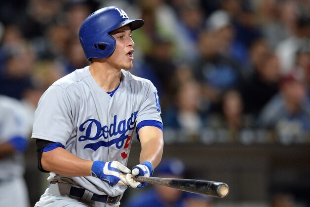 May 20, 2016; San Diego, CA, USA; Los Angeles Dodgers shortstop Corey Seager (5) hits an RBI double during the third inning against the San Diego Padres at Petco Park. Mandatory Credit: Jake Roth-USA TODAY Sports